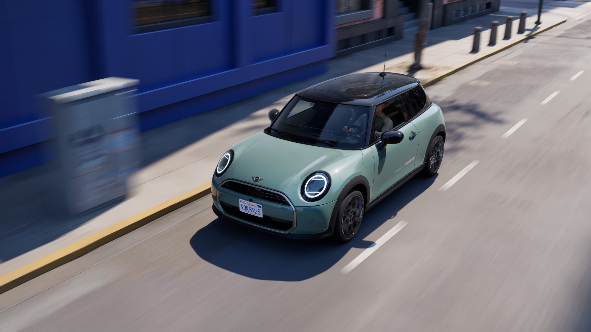 MINI Cooper driving down the road 